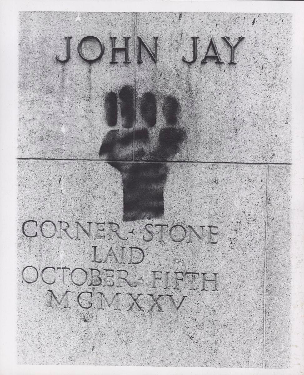 Stencil of Black Power Fist on the Wall of John Jay